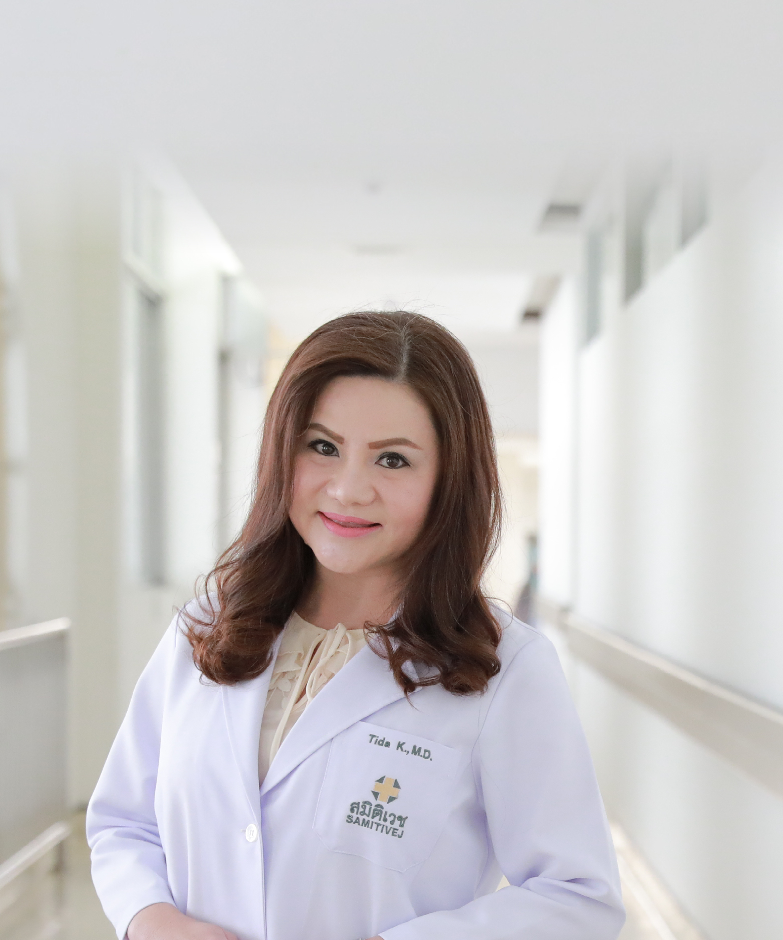 Tida Khomsiri, M.D.